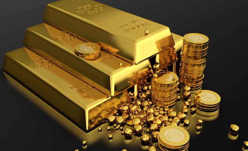 Ouro cai após Fed sinalizar possível alta de juros neste ano
